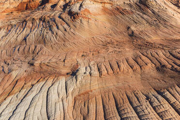 Stunning aerial view of eroded desert terrain showcasing nature's artistry in detailed patterns and textures. - ADSF50648