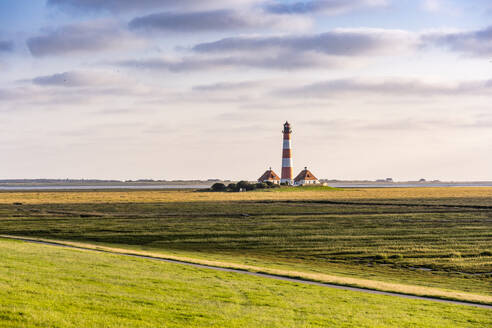 Germany, Schleswig-Holstein, Westerhever, Westerheversand Lighthouse at dusk - EGBF00974