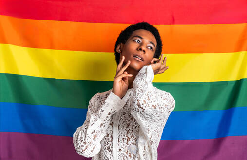 Fluid gender hispanic latin black man posing in studio with fashionable clothing, concepts about LGBTQ, genderless and diversity - DMDF08093