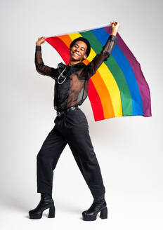 Fluid gender hispanic latin black man posing in studio with fashionable clothing, concepts about LGBTQ, genderless and diversity - DMDF08098