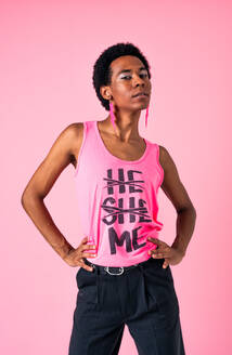 Fluid gender hispanic latin black man posing in studio with fashionable clothing, concepts about LGBTQ, genderless and diversity - DMDF08120