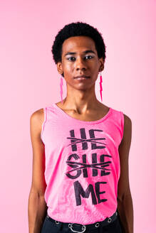 Fluid gender hispanic latin black man posing in studio with fashionable clothing, concepts about LGBTQ, genderless and diversity - DMDF08133