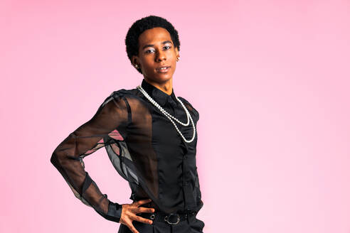 Fluid gender hispanic latin black man posing in studio with fashionable clothing, concepts about LGBTQ, genderless and diversity - DMDF08142