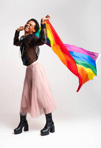Fluid gender hispanic latin black man posing in studio with fashionable clothing, concepts about LGBTQ, genderless and diversity - DMDF08143