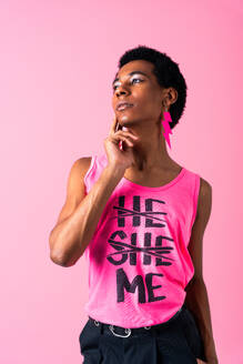 Fluid gender hispanic latin black man posing in studio with fashionable clothing, concepts about LGBTQ, genderless and diversity - DMDF08148