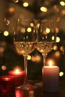 Burning candles and two glasses of white wine - JTF02386