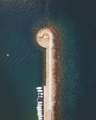 Aerial topdown of the lighthouse of Andratx Harbour, Mallorca, Baleares, Spain. - AAEF24939