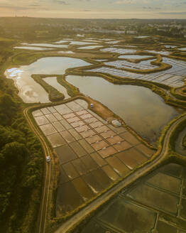 Aerial view of salt marshes at sunrise in Guérande, Loire-Atlantique, France. - AAEF24987