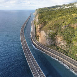 Aerial view of the new and old coastal road Route du Littoral connecting Saint Denis with La Possession, Réunion. - AAEF25137