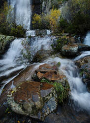 Serene Despeñalagua Waterfall amidst autumn foliage in Valverde de los Arroyos, Guadalajara. - ADSF50947