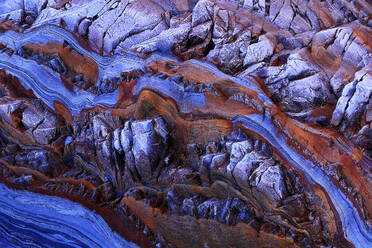 A high-resolution image capturing the intricate patterns and vivid colors of rock formations along the Occidental coast of Asturias in Spain. - ADSF51001