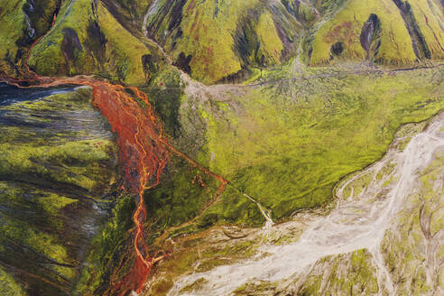 A mesmerizing aerial shot capturing the vibrant and diverse hues of the mountains and river basins at Landmannalaugar, Iceland - ADSF51077