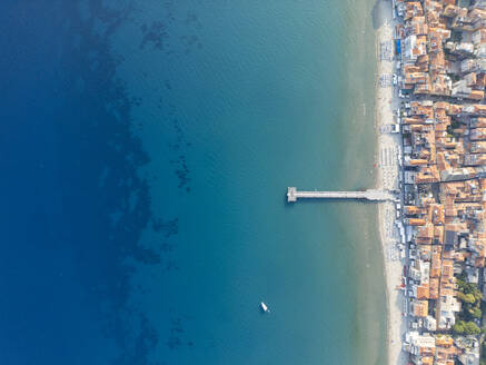 Aerial shot capturing the vibrant contrast of the cityscape against the azure sea along the shores of Nice, Côte d'Azur. - ADSF51518