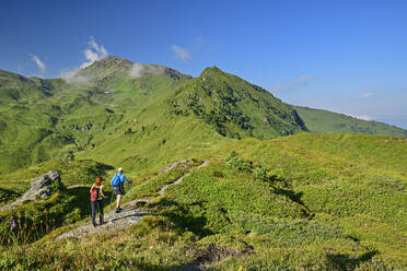 Austria, Tyrol, Man and woman hiking towards Gilfert - ANSF00721