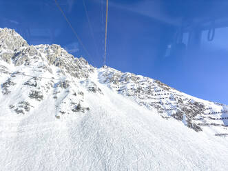 Austria, Tyrol, Hafelekarspitze seen from overhead cable car - MMAF01505