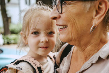 Portrait of cute girl with grandmother in city - MASF41549