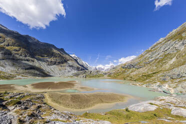 Sandersee lake with mountains under sky at Grossglockner, Austria - FOF13718