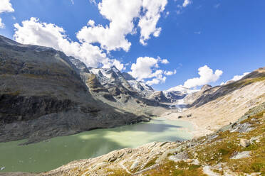 Sandersee lake near mountains under cloudy sky at Grossglockner, Austria - FOF13724