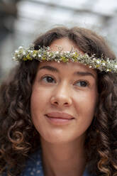 Contemplative young businesswoman wearing tiara - JOSEF22692