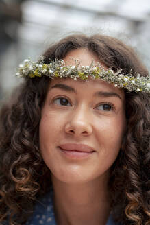 Contemplative young businesswoman wearing tiara - JOSEF22692