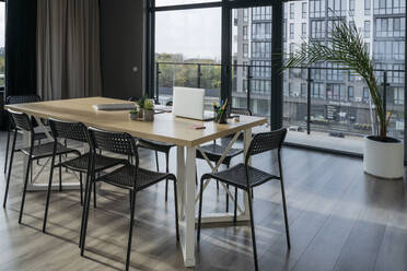 Table and chairs in meeting room at office - OSF02346