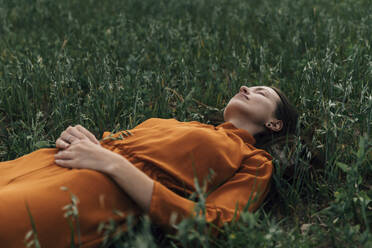 Woman with eyes closed in corn field - TOF00236