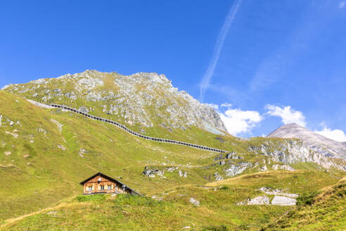 Mountain hut near avalanche construction on mountain at Hohe Tauern national park, Salzburg, Austria - FOF13727