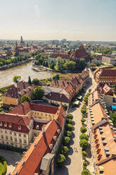 Poland, Lower Silesian Voivodeship, Wroclaw, Aerial view of Oder river and surrounding old town houses - TAMF04095