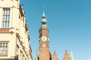 Poland, Lower Silesian Voivodeship, Wroclaw, Tower of historic town hall against clear sky - TAMF04115