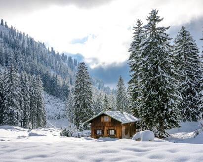 Germany, Bavaria, Secluded hut in snowcapped Allgau Alps - EGBF01022