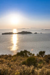 Greece, Ionian Islands, Sun setting over Nisida Kravi island - EGBF01039