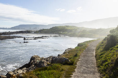 South Africa, Hermanus, Rocky coast and Kammabaai Beach at sunny day - TETF02426