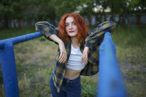 Redhaired woman posing at playground - TETF02448