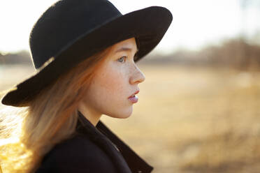 Portrait of young woman in hat on sunny day - TETF02506