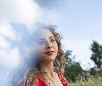 Young woman with curly hair wearing eyeglasses - BFRF02448