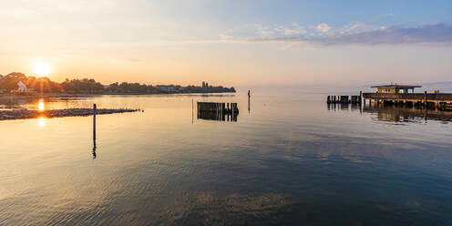 Germany, Baden-Wurttemberg, Langenargen, Pier on lake Bodensee at sunrise - WDF07507