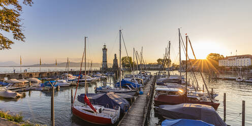 Germany, Bavaria, Lindau, Harbor on lake Bodensee at sunset - WDF07514