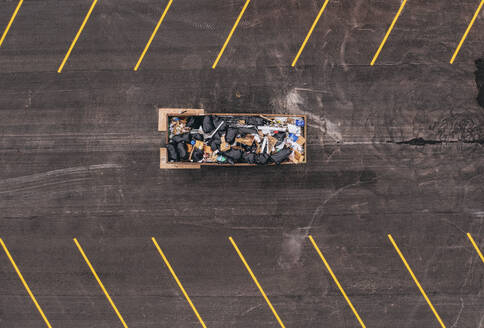 Aerial view of a dumpster bin in a parking lot, Vero Beach, Florida, United States. - AAEF25326