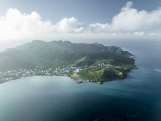 Aerial view of a small town along the bay at sunrise on Providencia and Santa Catalina Island, Archipelago of Saint Andrew, Colombia. - AAEF25357