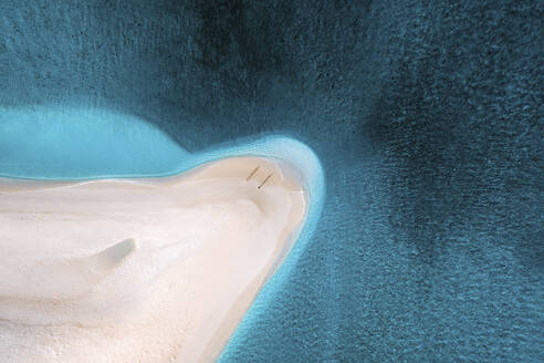 Aerial view of people on a sandbank along the shoreline with white sand beach, South Ari Atoll, Maldives. - AAEF25463