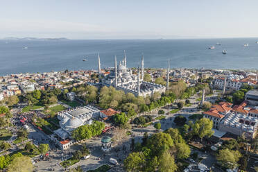 Aerial view of Sultanahmet Camii (the Blue Mosque) in Istanbul Sultanahmet district on the European side during the Muslim holiday, Turkey. - AAEF25513