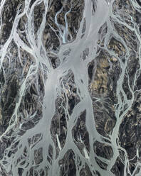 Aerial drone view river veins running through river bedding in Iceland. - AAEF25932