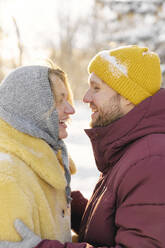 Cheerful couple enjoying in winter - SANF00177