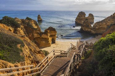 Portugal, Algarve, Lagos, Steps leading to Praia do Camilo beach - ABOF00949