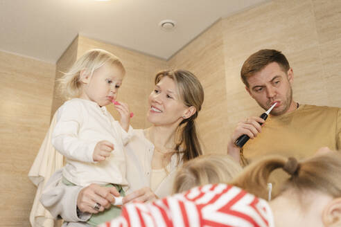 Family brushing teeth in bathroom at home - SEAF02182