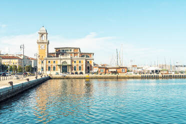 Italy, Friuli-Venezia Giulia, Trieste, Coastal promenade with Salone Degli Incanti event venue in background - TAMF04195