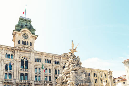 Italy, Friuli-Venezia Giulia, Trieste, Fountain of Four Continents with town hall in background - TAMF04198