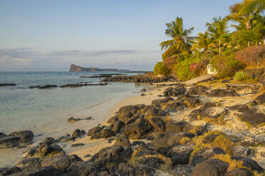 View of beach and turquoise Indian Ocean at sunset in Cap Malheureux, Mauritius, Indian Ocean, Africa - RHPLF31579