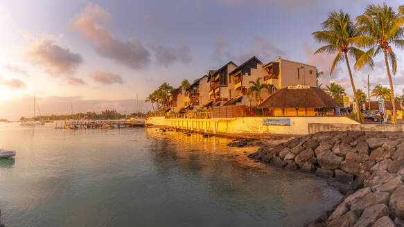 View of waterside apartments in Grand Bay at sunset, Mauritius, Indian Ocean, Africa - RHPLF31615