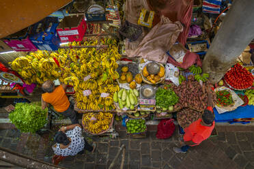 View of produce including vegetables and bananas on market stalls in Central Market in Port Louis, Port Louis, Mauritius, Indian Ocean, Africa - RHPLF31645